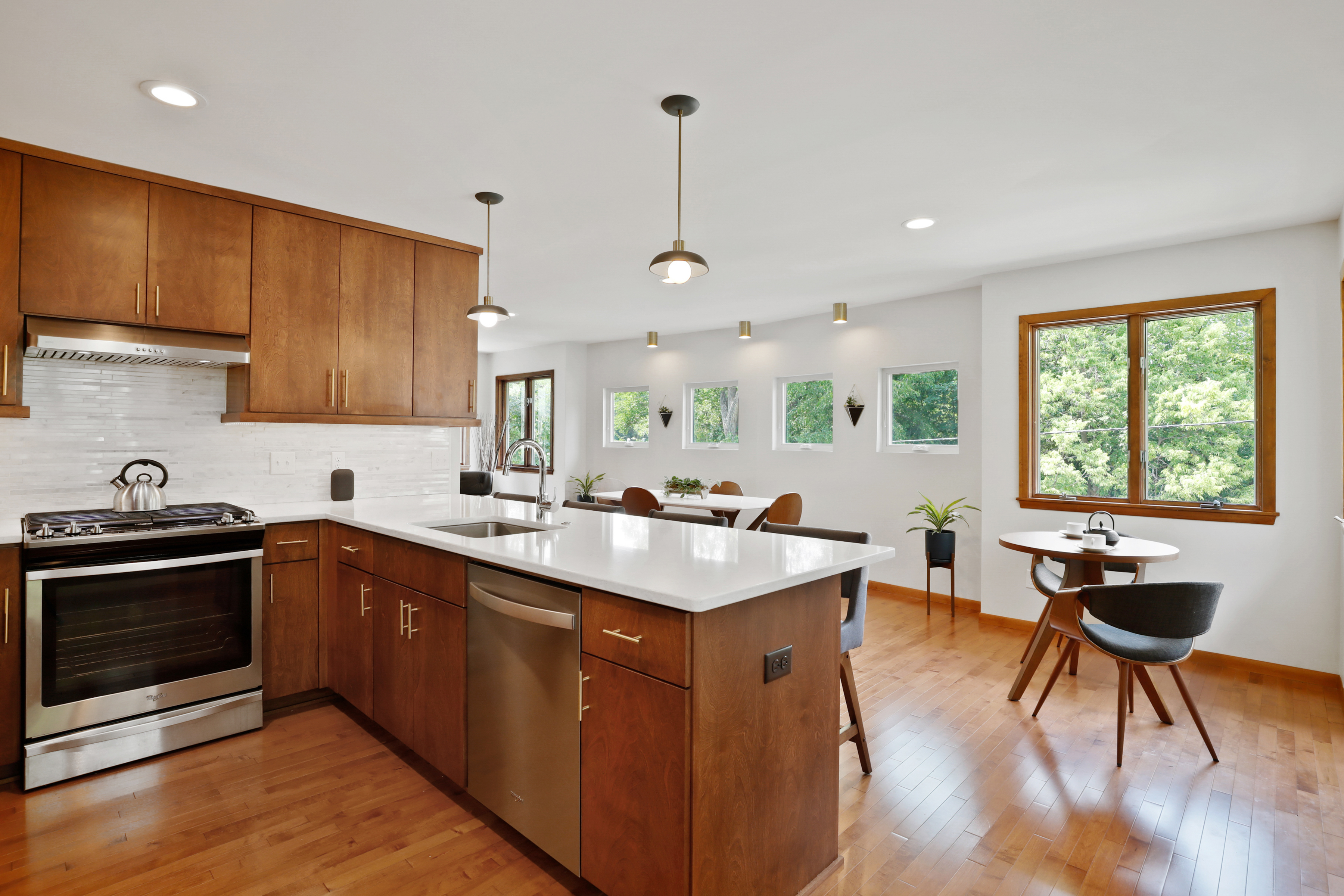 view of dining room from behind the kitchen peninsula counter