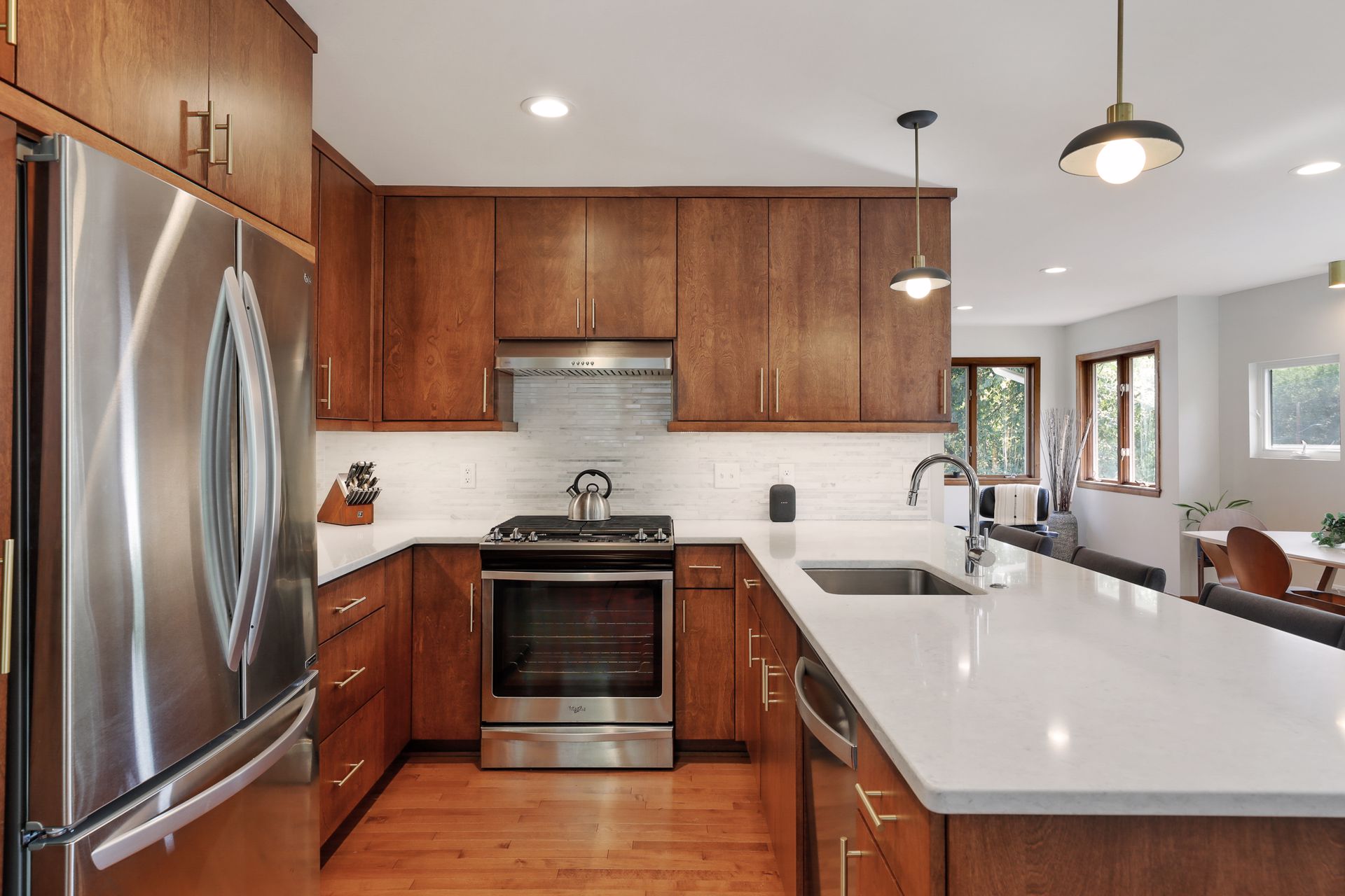 Kitchen features professional range and ample, soft-close cabinets.