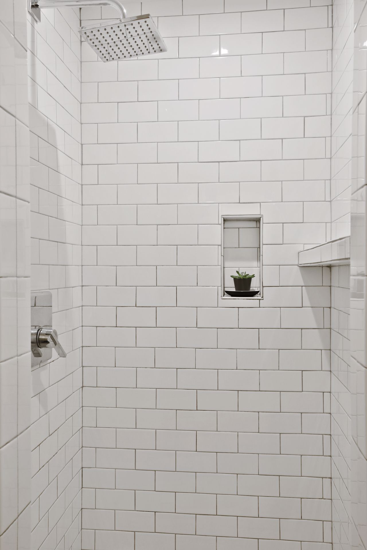 view of tiled shower in master bathroom